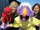 Quack and Wabbit puppeteers with their puppet characters.