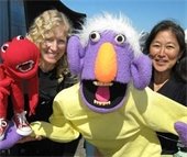 Quack and Wabbit puppeteers with their puppet characters.