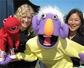 Quack and Wabbit puppeteers with their puppet characters.