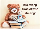 It's story time at the library. A teddy bear with a pile of books.
