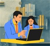 Computer help at the Library. Two individuals looking at a laptop.