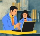 Computer help at the Library. Two individuals looking at a laptop.