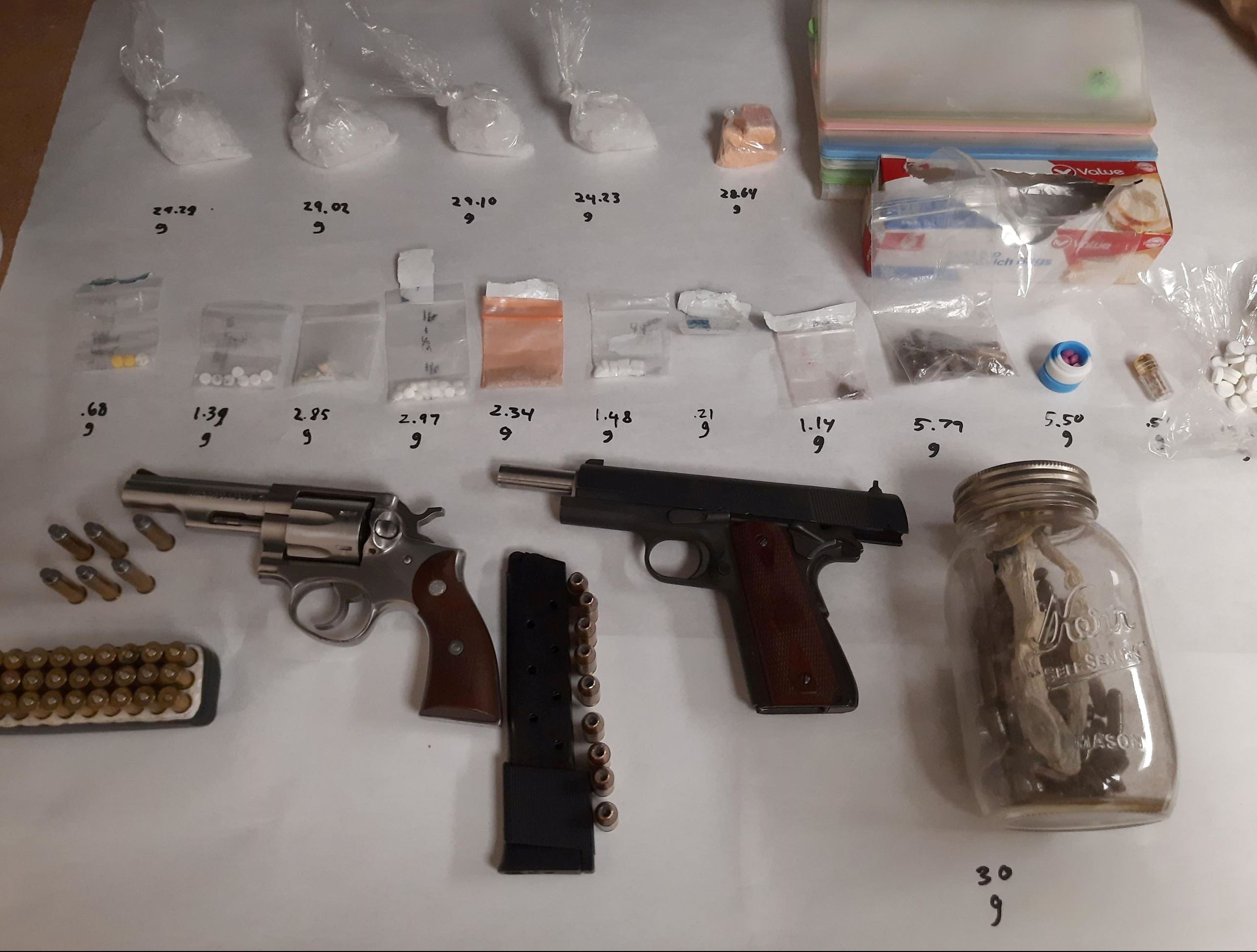 Various drugs and guns seized during probation search