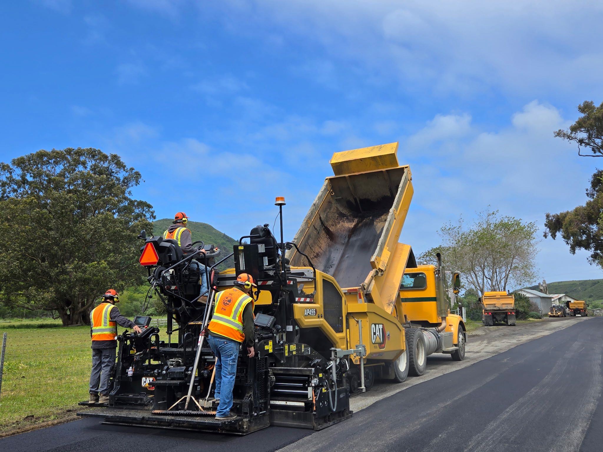 Public Works road crew conducts paving work on Mattole Road.