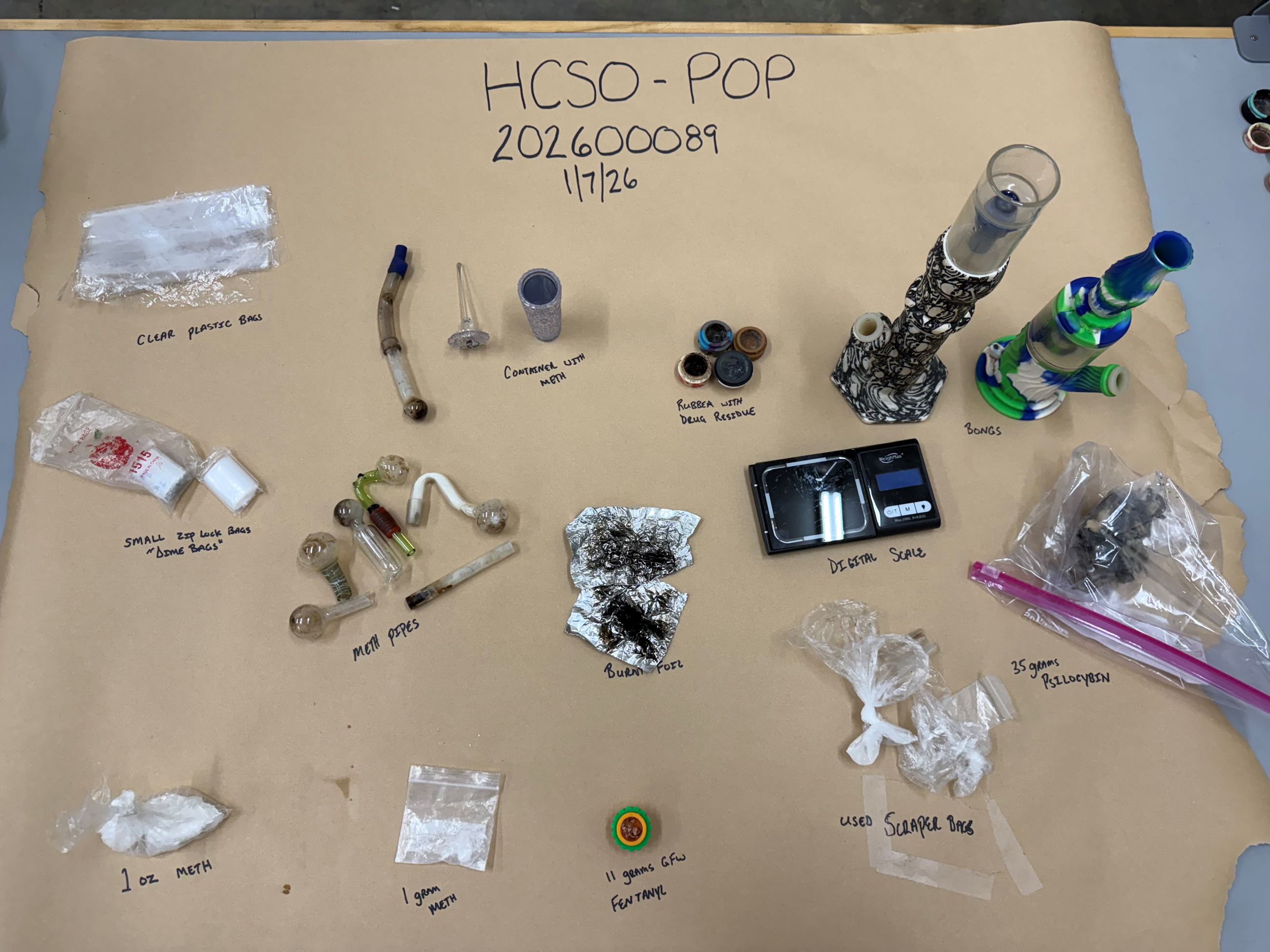 Photo of seized evidence ( Drugs and drug paraphernalia)
