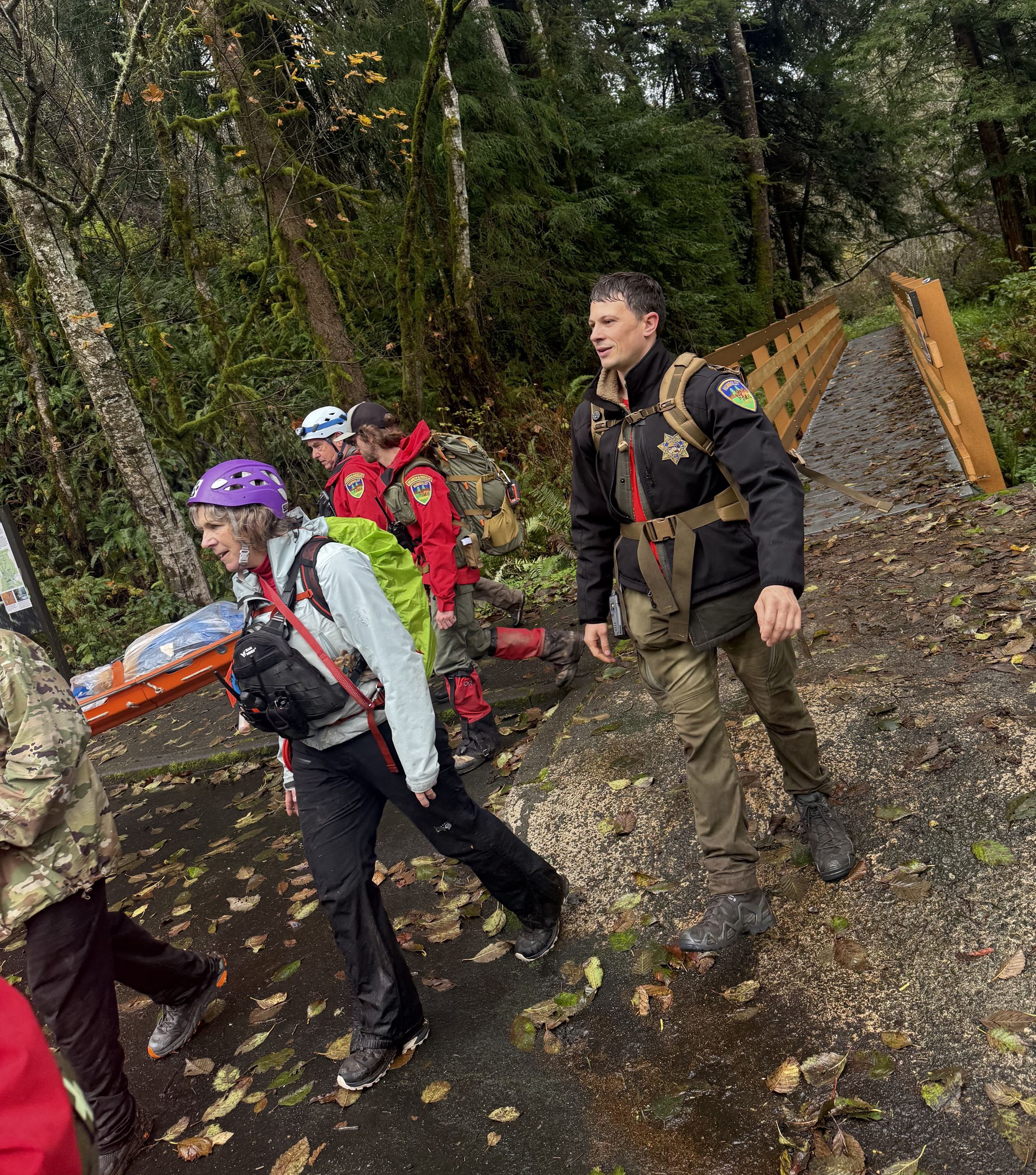 Photo of HCSO SAR team carrying hiker on rescue stretcher