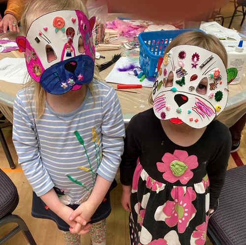 Children wearing their crafted mask at Godwit Days