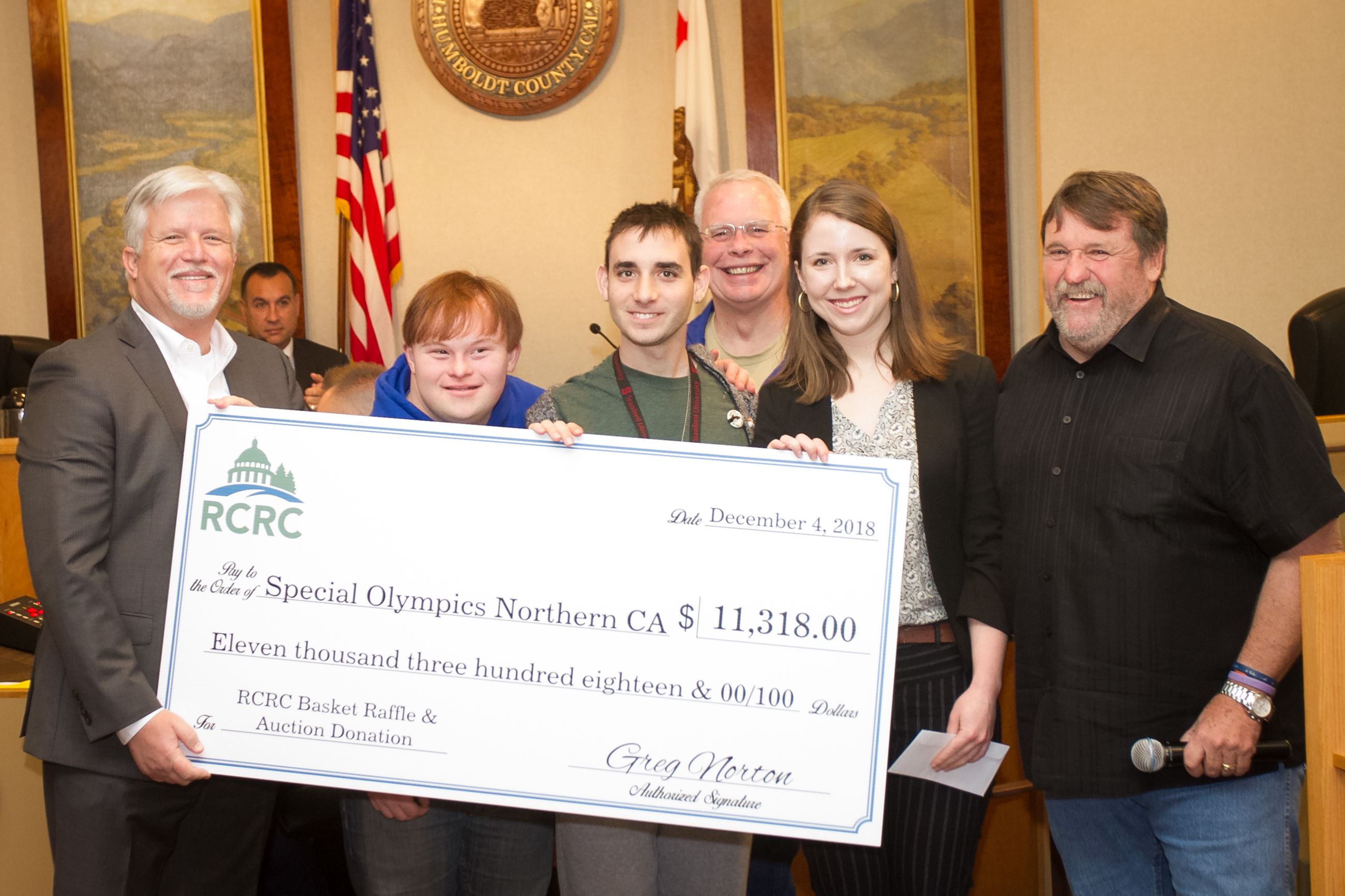 Supervisor Rex Bohn, right, and RCRC Chief Executive Officer Greg Norton, left, present the Special 